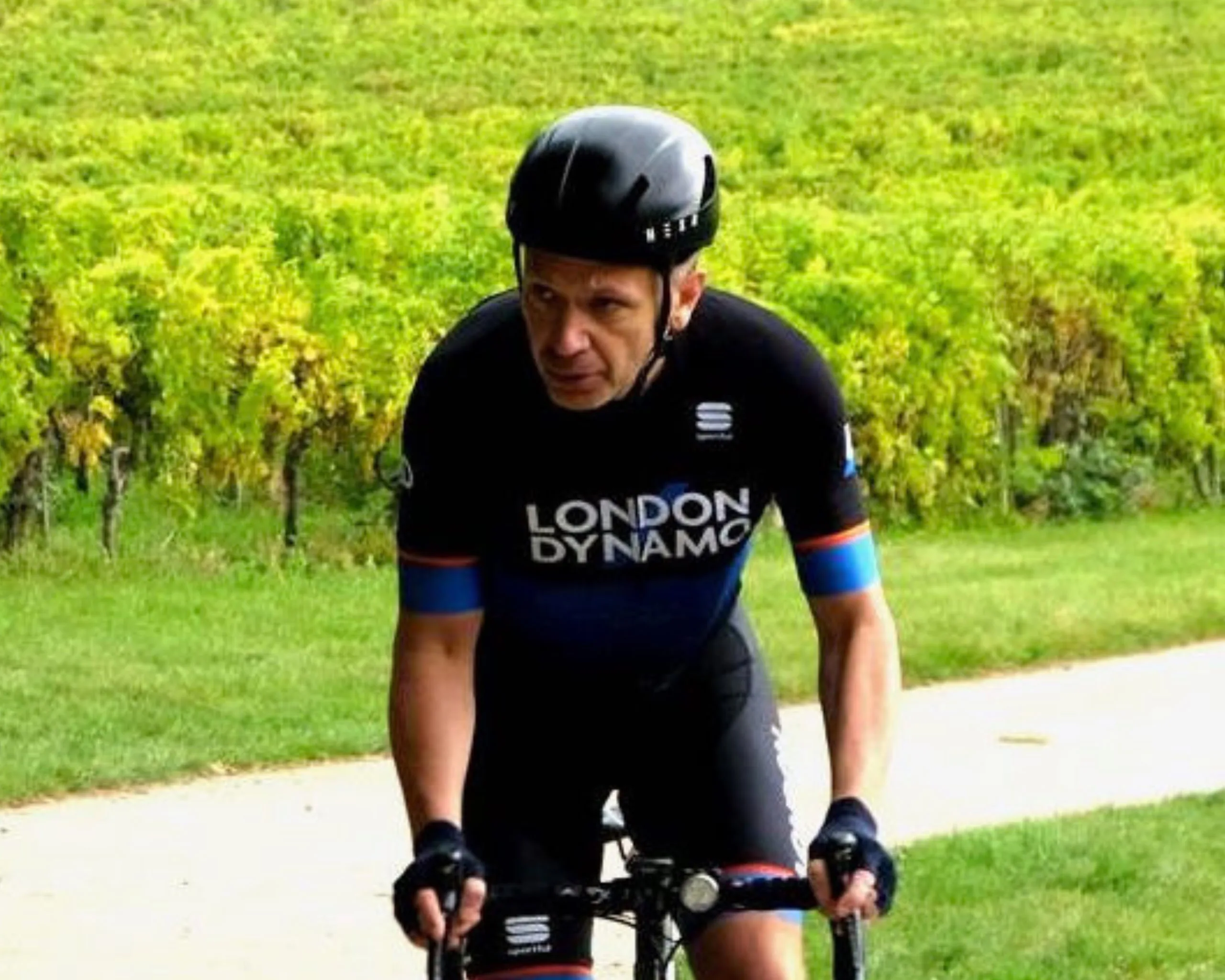 London Dynamo James Middleton rising his bike at Denbies Hill Climb