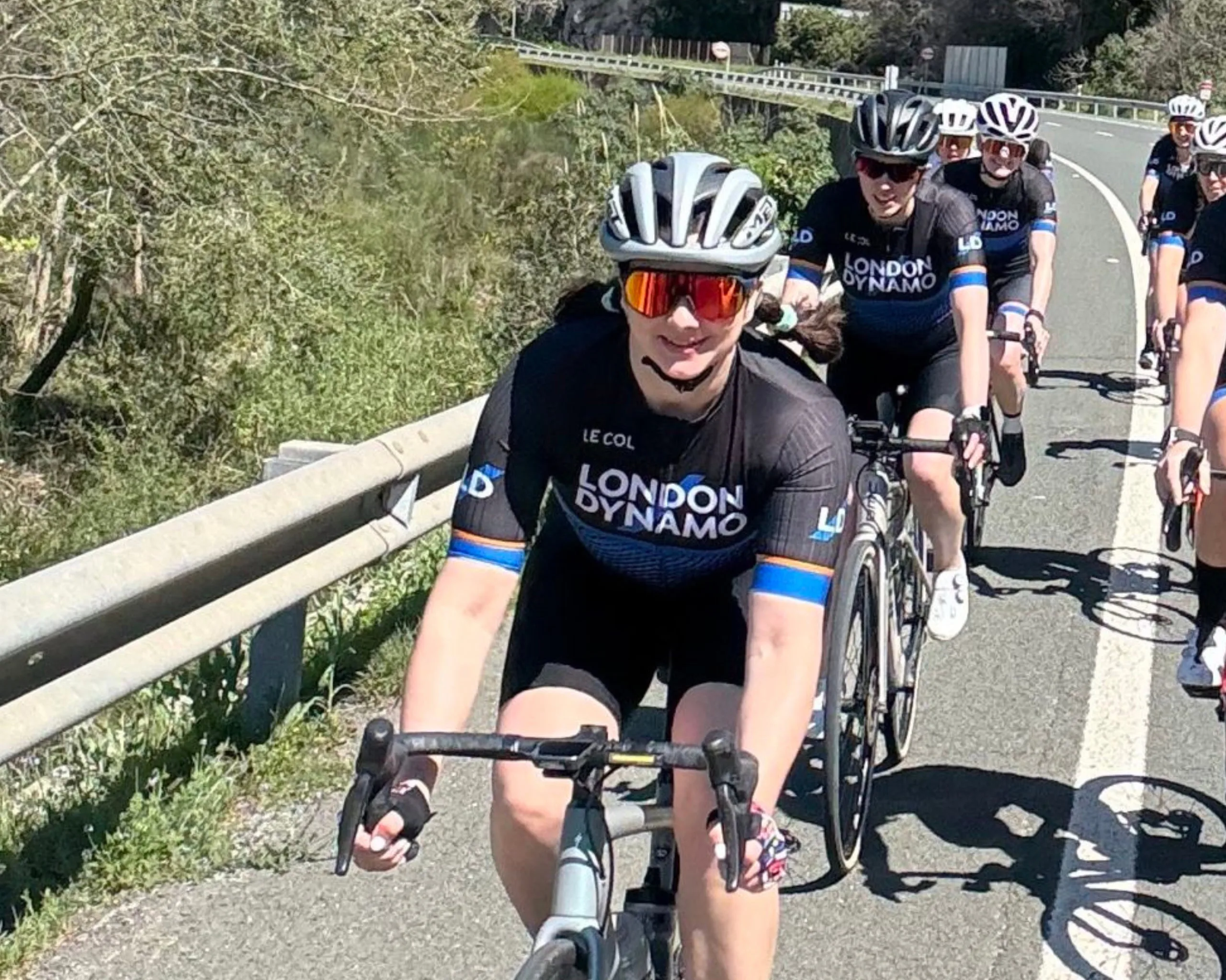London Dynamo Kerry McCallum riding her bike in a group of women in Spain