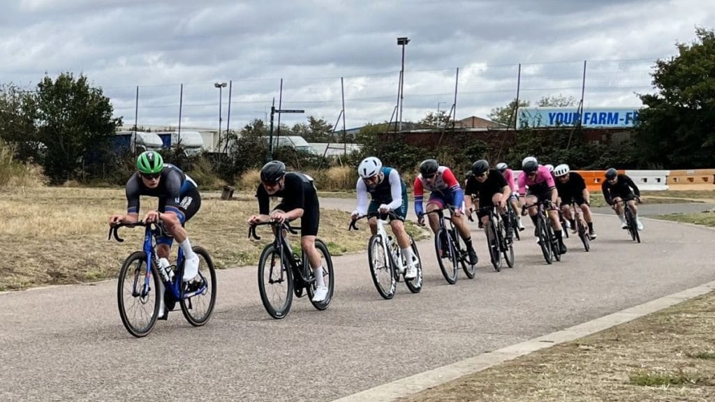 A line of London Dynamo riders racing around Hillingdon Cycle Circuit